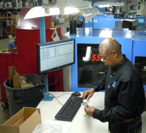 Picture of MET Plastics using instrument to enter measurement into Synergy software. Picture of MET Plastics using instrument to enter measurement into Synergy software.